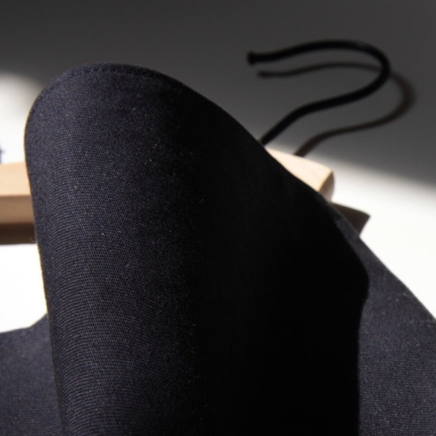 Tangled dark threads on light surface